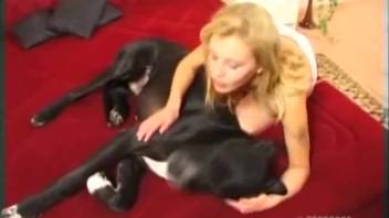 Aroused fair-haired woman craves the dog's entire shaft in her tight vagina