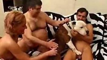 Two men, one female and a dog in crazy bestiality foursome