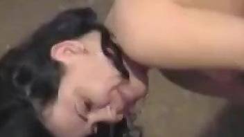 Brunette displaying amazing oral skills with a horse