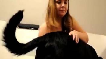 Inked chubster sucking on a black dog's hard cock